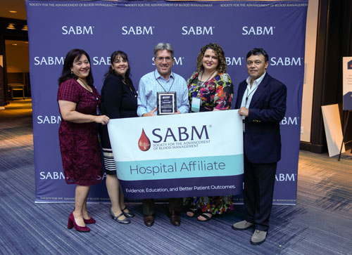 Representatives from SABM awarding a hospital affiliate certificate to representatives from Englewood Health