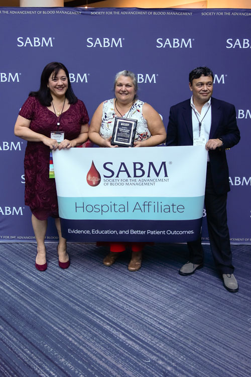 Representatives from SABM awarding a hospital affiliate certification to representatives from Med Star Georgetown University Hospital
