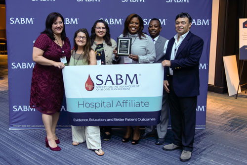Representatives from SABM awarding a hospital affiliate certification to representatives from ProMedica Flower Hospital